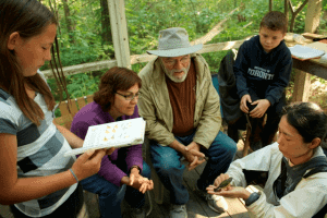 PIBO biologist Sumiko Onishi gives a bird banding demonstration for guests at the banding station.